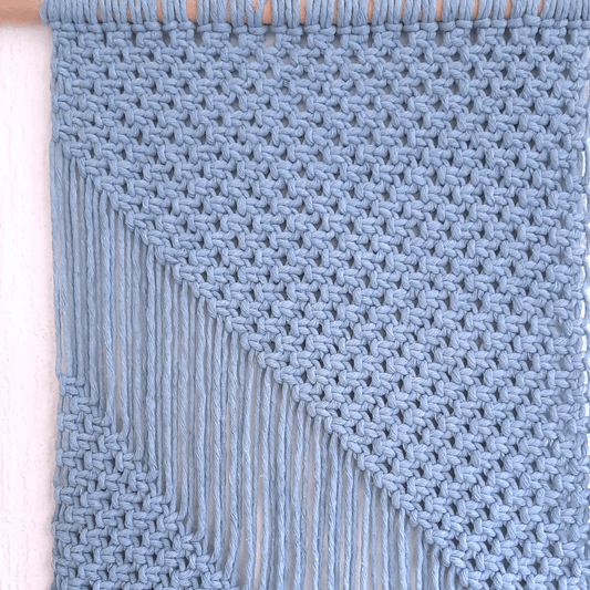 Close-up foto van een Macrame wandkleed